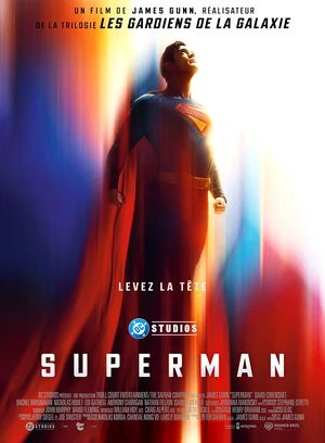 Official Superman movie poster showcasing the Man of Steel in his classic red cape with cinematic lighting for the upcoming DC superhero movie.